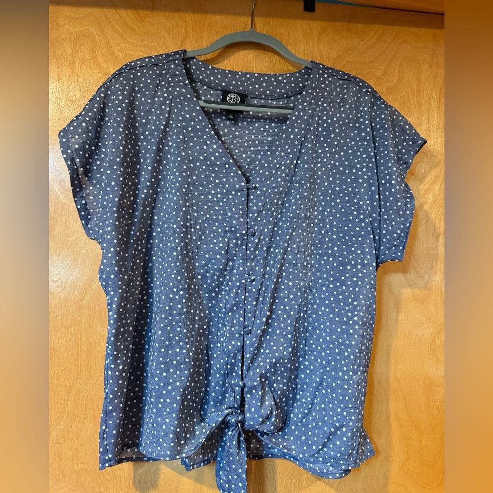 Flirty blouse ties in front with button detail
